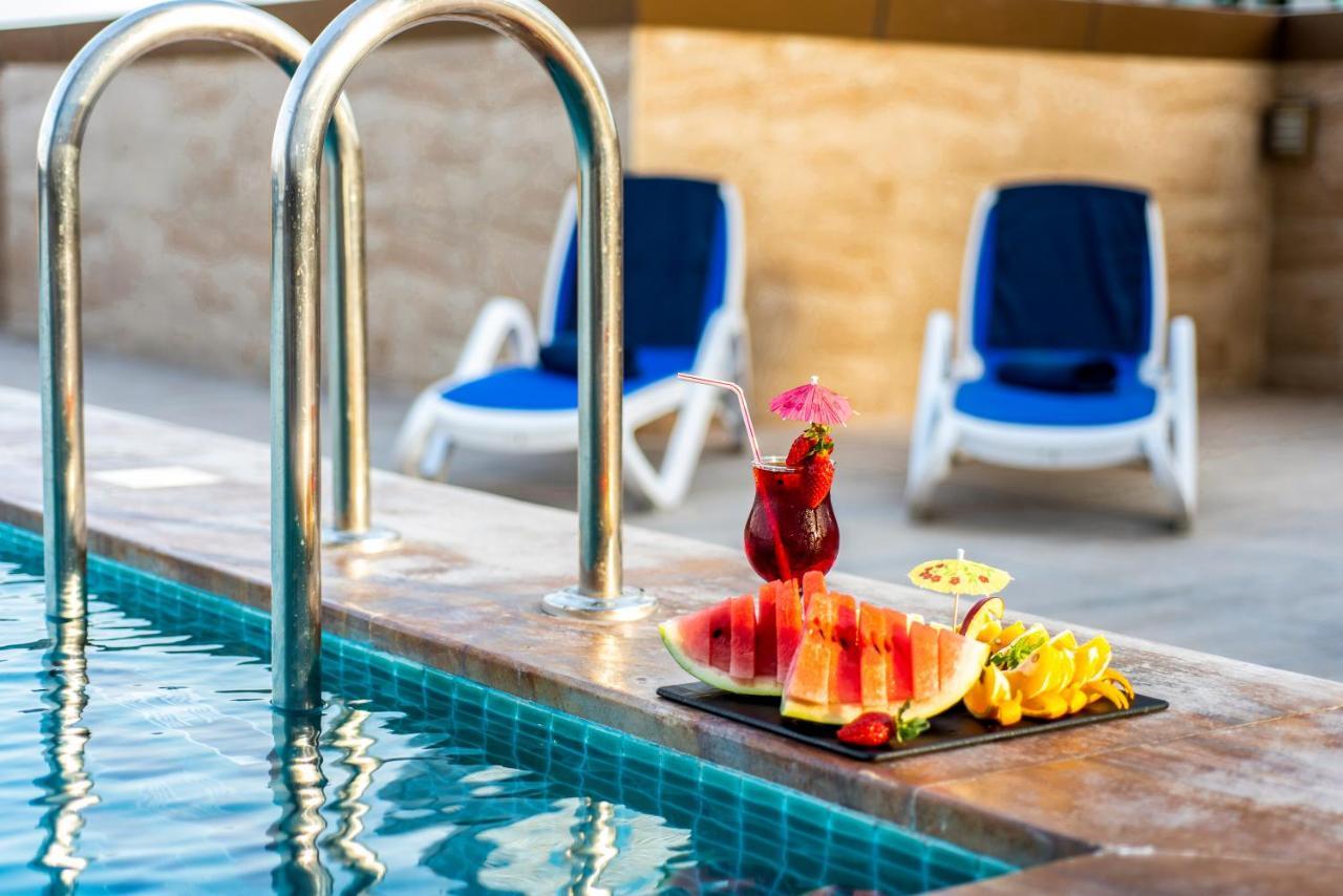 Luxe Grand Hotel Apartments Шарджа Экстерьер фото Pool at the hotel