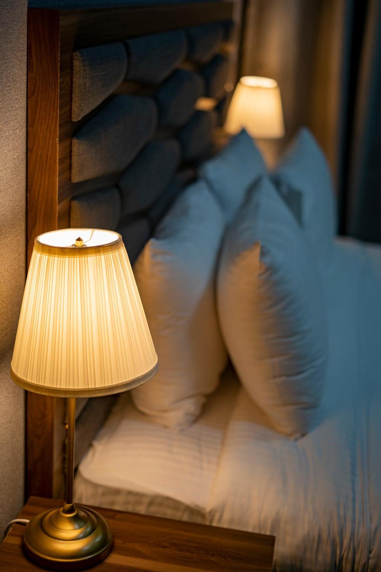 Luxe Grand Hotel Apartments Шарджа Экстерьер фото A pleated lampshade